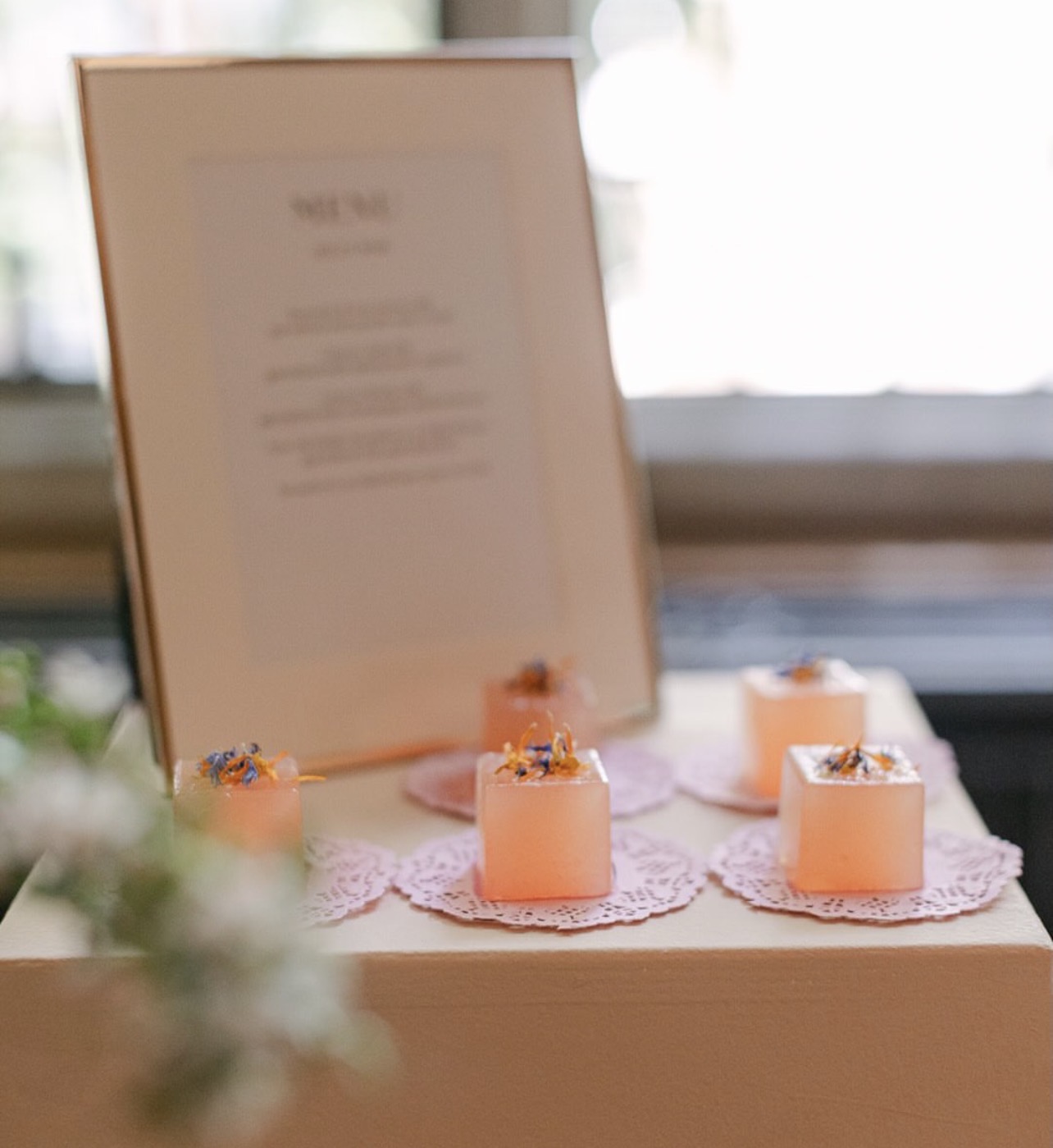 Dessert course presented beside a framed menu card